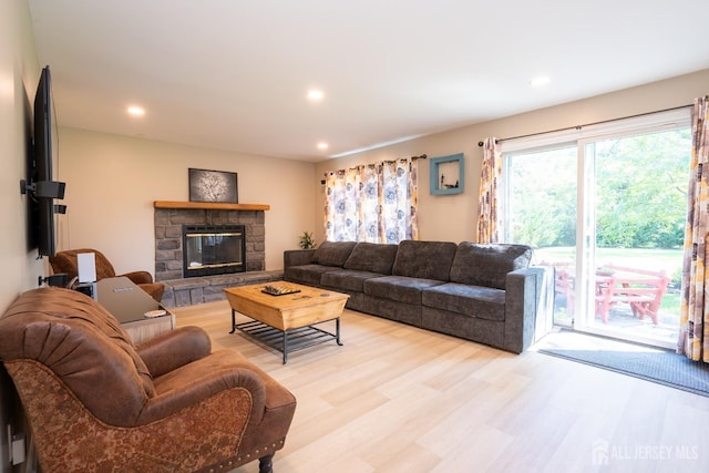 10 Chelsea Ct, South Brunswick, NJ 08810 - living room with a stone fireplace, light wood-style flooring, and recessed lighting