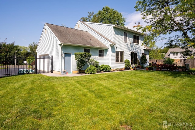 10 Chelsea Ct, South Brunswick, NJ 08810 - rear view of property featuring a chimney and a garage