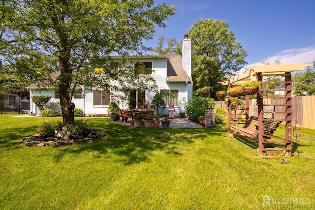 10 Chelsea Ct, South Brunswick, NJ 08810 - rear view of house with a patio and a chimney