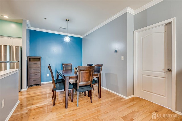 822 Dominick Ct, South Plainfield, NJ 07080 - dining room featuring ornamental molding, light wood finished floors, and baseboards