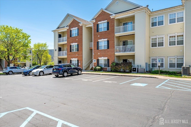822 Dominick Ct, South Plainfield, NJ 07080 - view of apartment building / complex with uncovered parking and central air condition unit