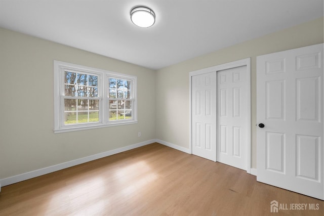 651 Myrtle Rd, North Brunswick, NJ 08902 - unfurnished bedroom with light wood finished floors, baseboards, and a closet