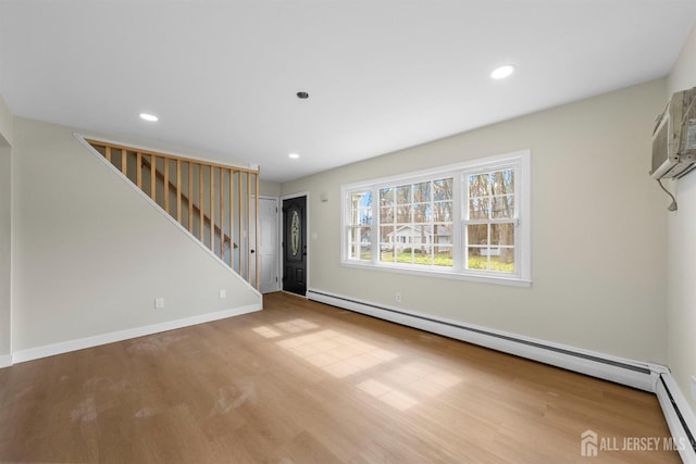 651 Myrtle Rd, North Brunswick, NJ 08902 - unfurnished living room with stairway, wood finished floors, baseboard heating, recessed lighting, and baseboards