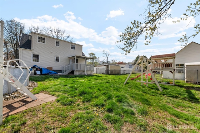 651 Myrtle Rd, North Brunswick, NJ 08902 - view of yard with a playground and a wooden deck