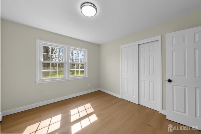 651 Myrtle Rd, North Brunswick, NJ 08902 - unfurnished bedroom featuring wood finished floors, baseboards, and a closet