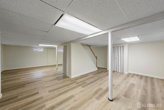 651 Myrtle Rd, North Brunswick, NJ 08902 - finished below grade area with a paneled ceiling, wood finished floors, stairway, and baseboards
