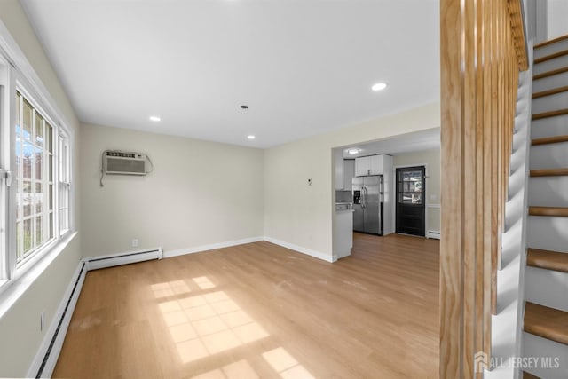651 Myrtle Rd, North Brunswick, NJ 08902 - spare room with stairs, a wall mounted AC, healthy amount of natural light, baseboard heating, and recessed lighting