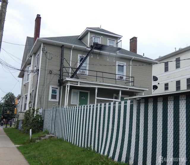 163 Livingston Ave, New Brunswick, NJ 08901 - view of side of property featuring a balcony and a chimney