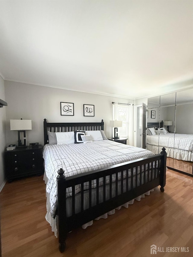 23 Prospect St, Old Bridge, NJ 08857 - bedroom with wood finished floors and ornamental molding