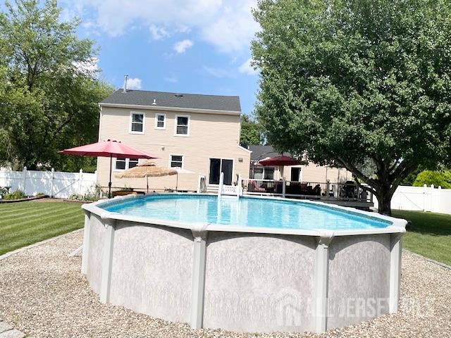 23 Prospect St, Old Bridge, NJ 08857 - view of pool featuring a fenced backyard and a deck