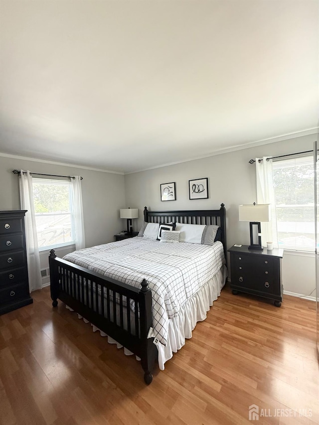 23 Prospect St, Old Bridge, NJ 08857 - bedroom featuring wood finished floors and crown molding