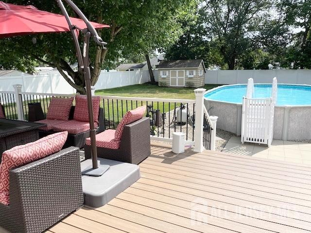 23 Prospect St, Old Bridge, NJ 08857 - wooden deck with a fenced backyard and a shed
