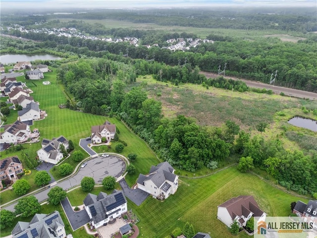 6 Monet Ct, South Brunswick, NJ 08852 - aerial view of property and surrounding area with a large body of water and nearby suburban area