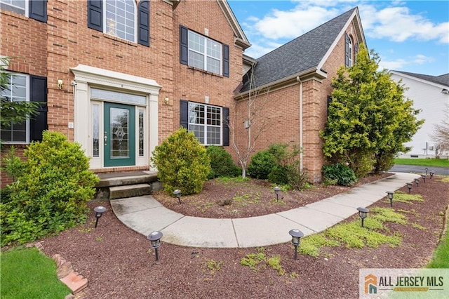 6 Monet Ct, South Brunswick, NJ 08852 - entrance to property featuring brick siding and a shingled roof