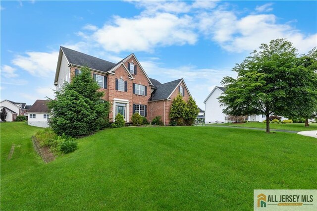 6 Monet Ct, South Brunswick, NJ 08852 - view of front of house with a front lawn and brick siding