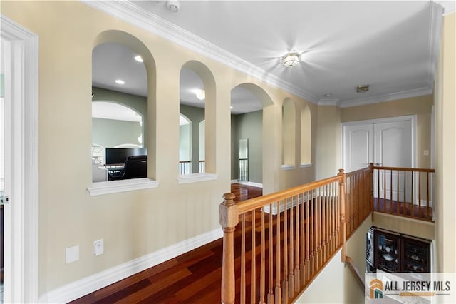 6 Monet Ct, South Brunswick, NJ 08852 - hallway featuring wood finished floors, ornamental molding, and an upstairs landing