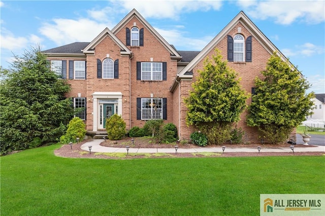 6 Monet Ct, South Brunswick, NJ 08852 - view of front of home with a front yard and brick siding