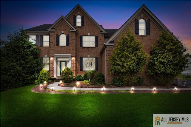 6 Monet Ct, South Brunswick, NJ 08852 - view of front of property featuring a lawn and brick siding