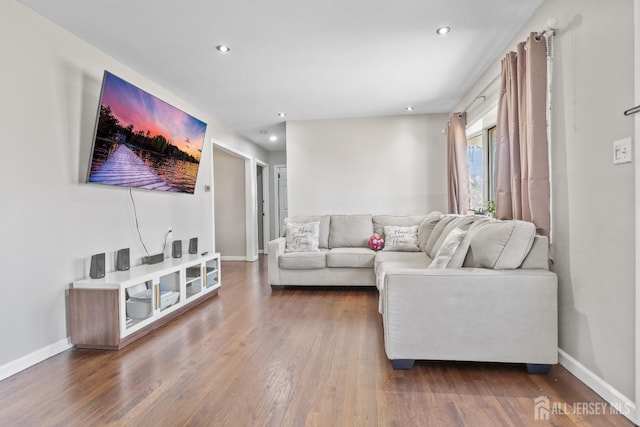 living room with recessed lighting, dark wood finished floors, and baseboards