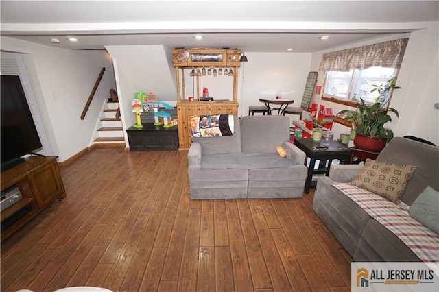 living room with stairs, hardwood / wood-style floors, recessed lighting, and baseboards