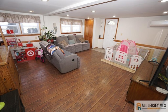 living room with a wall unit AC, wood-type flooring, and recessed lighting