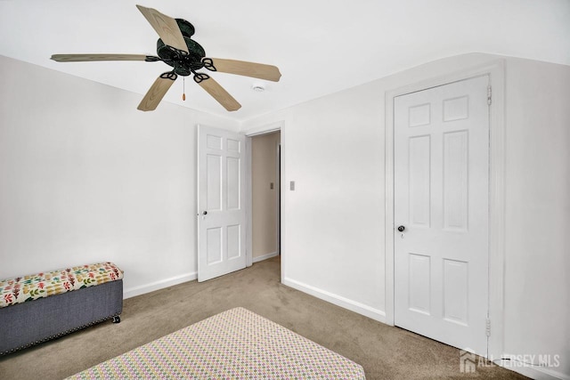 bedroom featuring baseboards, ceiling fan, and carpet