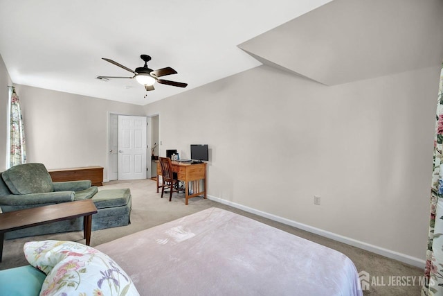 bedroom with a ceiling fan, baseboards, and light carpet