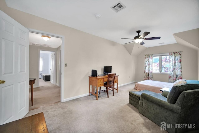 carpeted bedroom featuring a ceiling fan, baseboards, visible vents, and vaulted ceiling