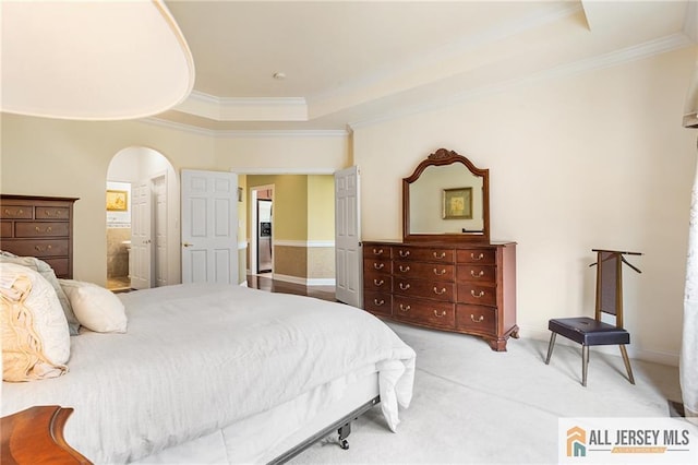 34 Schindler Ct Unit 17, Lawrence, NJ 08648 - bedroom featuring a tray ceiling, ornamental molding, arched walkways, light carpet, and ensuite bathroom