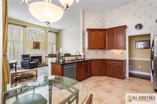 34 Schindler Ct Unit 17, Lawrence, NJ 08648 - kitchen with a sink, appliances with stainless steel finishes, wallpapered walls, healthy amount of natural light, and a peninsula