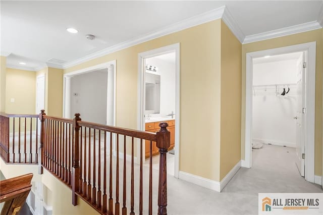 34 Schindler Ct Unit 17, Lawrence, NJ 08648 - hallway with an upstairs landing, ornamental molding, light carpet, baseboards, and recessed lighting