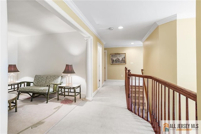 34 Schindler Ct Unit 17, Lawrence, NJ 08648 - hall featuring an upstairs landing, crown molding, carpet floors, baseboards, and decorative columns