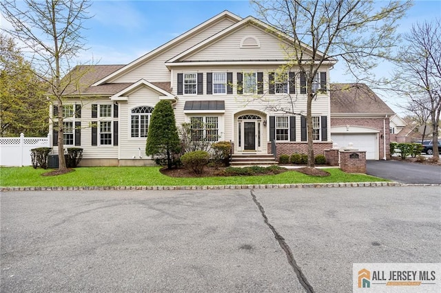 34 Schindler Ct Unit 17, Lawrence, NJ 08648 - view of front of property featuring driveway, an attached garage, and brick siding