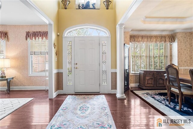 34 Schindler Ct Unit 17, Lawrence, NJ 08648 - foyer with wallpapered walls, decorative columns, healthy amount of natural light, hardwood / wood-style floors, and crown molding