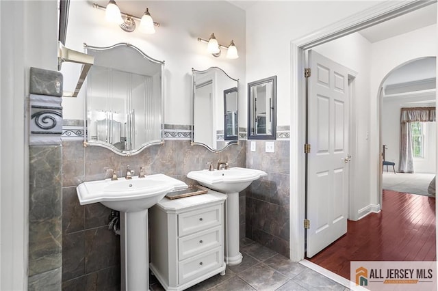 34 Schindler Ct Unit 17, Lawrence, NJ 08648 - full bathroom featuring tile walls and a wainscoted wall