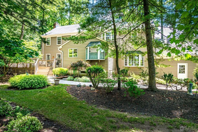 view of front of property featuring a wooden deck