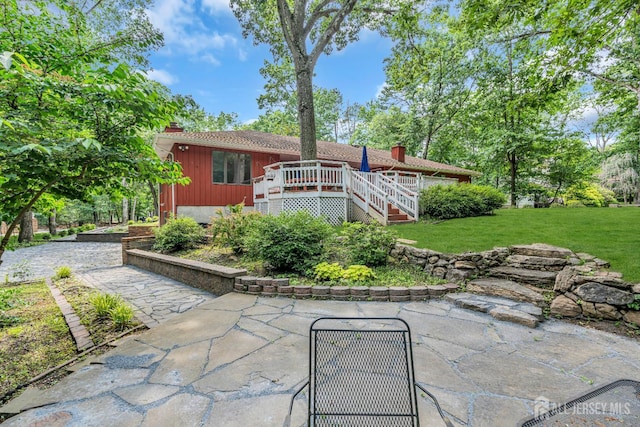 2 Crommelin Ct, East Brunswick, NJ 08816 - back of house featuring a chimney, a lawn, a deck, and a patio area