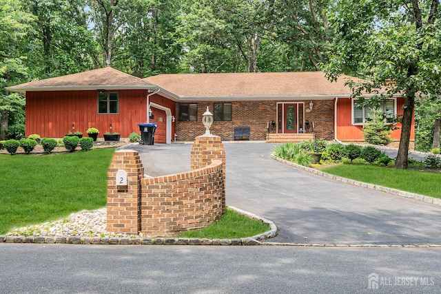 2 Crommelin Ct, East Brunswick, NJ 08816 - ranch-style home featuring asphalt driveway, a garage, a front lawn, and a shingled roof