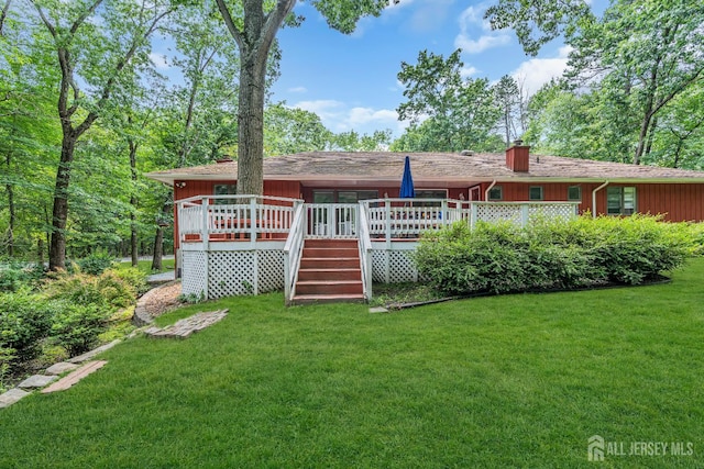 2 Crommelin Ct, East Brunswick, NJ 08816 - back of house featuring a yard, a chimney, a wooden deck, and board and batten siding