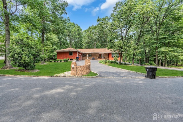 2 Crommelin Ct, East Brunswick, NJ 08816 - view of front of home featuring asphalt driveway, a front lawn, and a garage