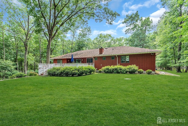 2 Crommelin Ct, East Brunswick, NJ 08816 - rear view of house with a yard and a chimney