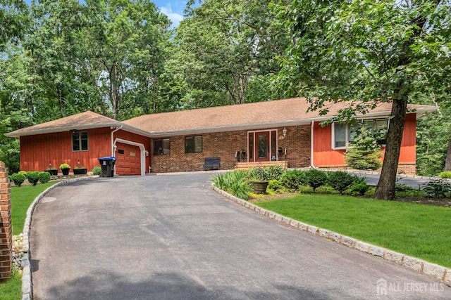 2 Crommelin Ct, East Brunswick, NJ 08816 - single story home featuring an attached garage, a front yard, driveway, and brick siding