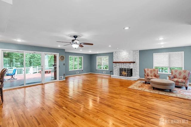 2 Crommelin Ct, East Brunswick, NJ 08816 - living room with light wood-type flooring, recessed lighting, ceiling fan, and a fireplace