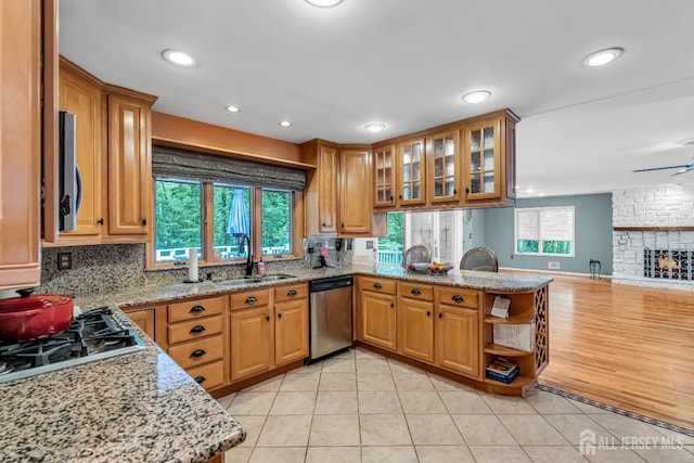 2 Crommelin Ct, East Brunswick, NJ 08816 - kitchen with stainless steel appliances, a peninsula, light stone counters, light tile patterned floors, and recessed lighting