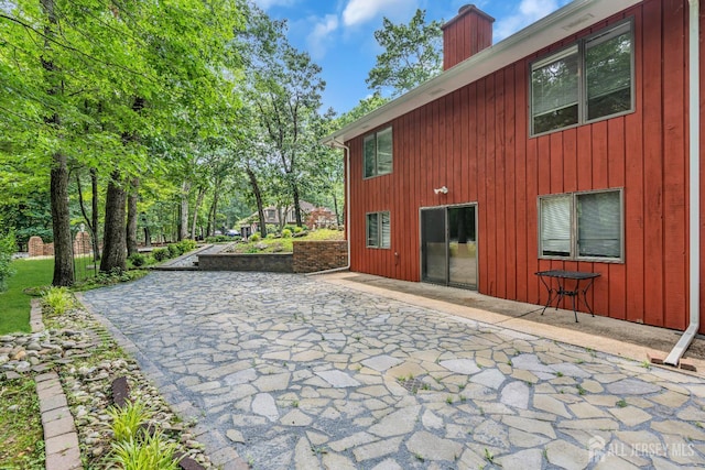 2 Crommelin Ct, East Brunswick, NJ 08816 - rear view of property with a chimney and a patio
