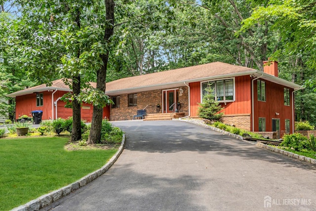 2 Crommelin Ct, East Brunswick, NJ 08816 - ranch-style home with driveway, a chimney, a front lawn, brick siding, and an attached garage