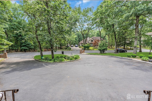 2 Crommelin Ct, East Brunswick, NJ 08816 - view of street featuring view of wooded area and curbs