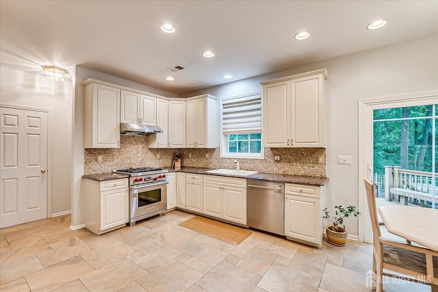35 Fabiszewski Way, Parlin, NJ 08859 - kitchen with appliances with stainless steel finishes, under cabinet range hood, a sink, tasteful backsplash, and recessed lighting