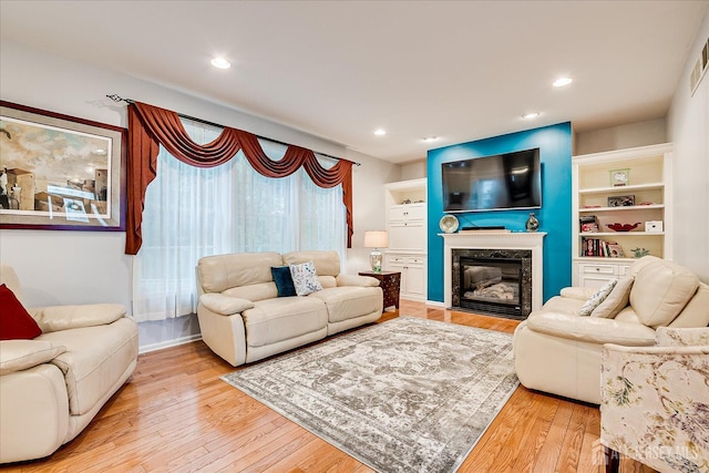 35 Fabiszewski Way, Parlin, NJ 08859 - living room with a fireplace, wood-type flooring, and recessed lighting