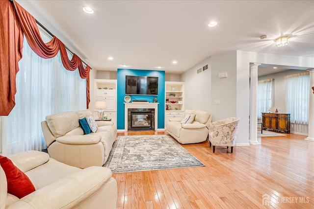 35 Fabiszewski Way, Parlin, NJ 08859 - living room with hardwood / wood-style flooring, a premium fireplace, decorative columns, baseboards, and recessed lighting